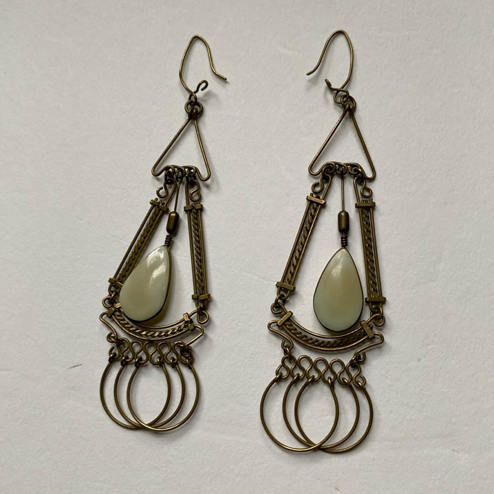 Brass exotic earrings with cream coloured insert stone
